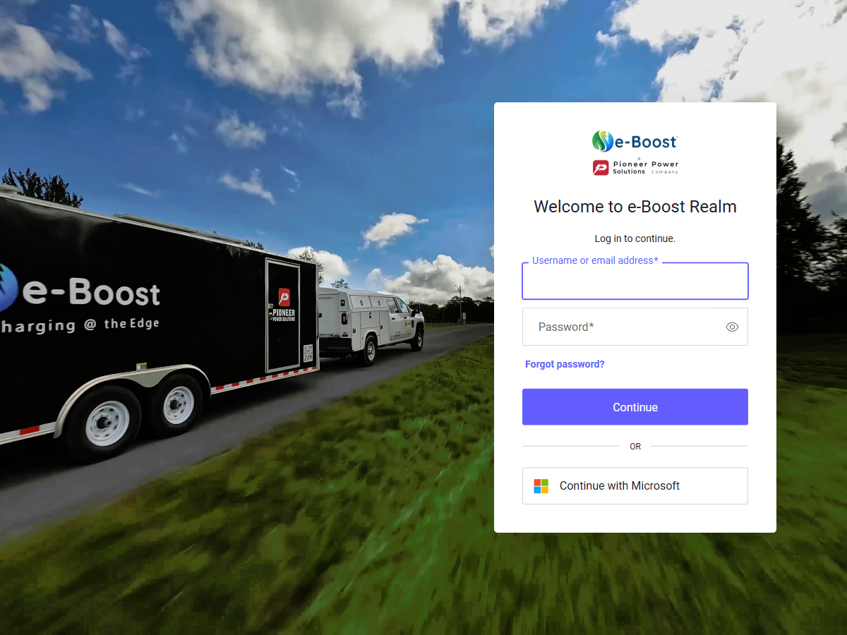 e-Boost Realm login page showing username/password fields and Continue with Microsoft button
